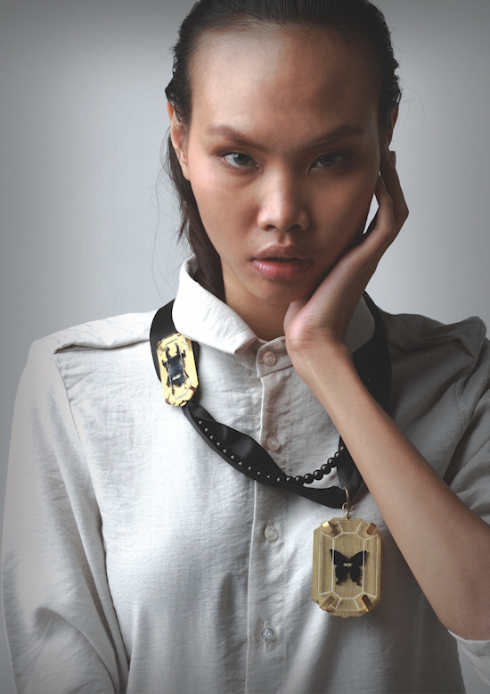 Thai model with deux charms necklace by Wonder Anatomie