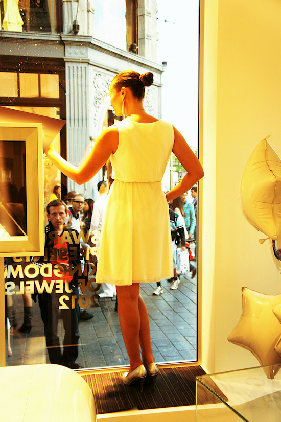 Model posing behind the window @ Swarovski Shop in Amsterdam. Dam Square 6.