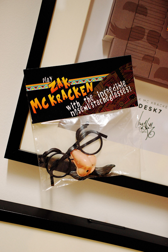 "Play Zack McKracken with the incredible nose mustache glasses!" by Desk7 @ We Love 8-Bit exhibition Vienna