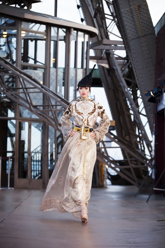 Jessica Minh Anh in a couture dress by OM Fiore on the Eiffel Tower.